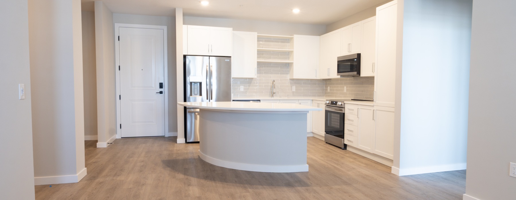 a kitchen with white cabinets