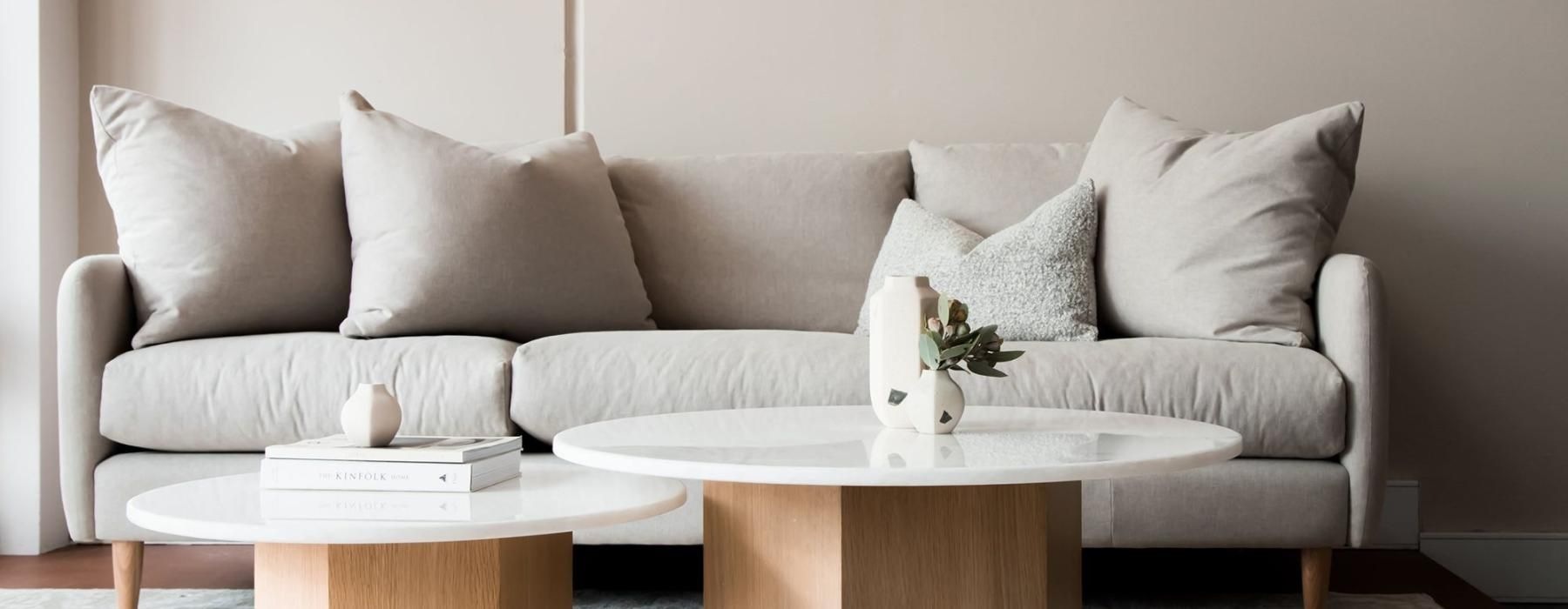 a white couch with a coffee table at The Rowan - apartments for rent in Oviedo, FL